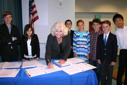 Emily Andrade from EUSD School Board signing the end of year SWPPP documents 
