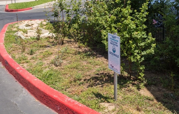 Permanent sign installed in parking lot island at La Costa Heights